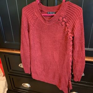 Crimson sweater with braided open siding